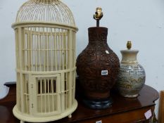 TWO TABLE LAMPS AND A WOODEN BIRDCAGE.