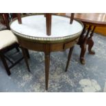 A FRENCH MARBLE TOP CIRCULAR TABLE WITH BRASS GALLERY.