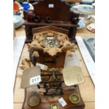 ANTIQUE POSTAGE SCALES, A CUCKOO CLOCK, A WALNUT PIPE RACK WITH BRAIR AND OTHER PIPES.