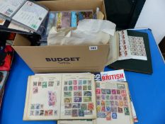 A LARGE COLLECTION OF POSTCARDS, STAMPS AND ALBUMS.