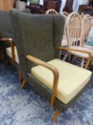 TWO SIMILAR MID CENTURY WING ARM CHAIRS.