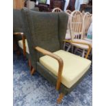 TWO SIMILAR MID CENTURY WING ARM CHAIRS.