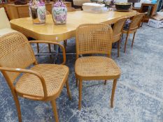 A SET OF EIGHT BENTWOOD CANE SEAT AND BACK DINING CHAIRS.