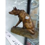 A BRONZE FIGURE OF A SEATED HUNTING DOG SIGNED L.RICHE.