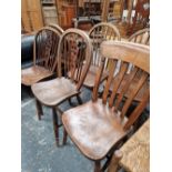 A 19th C. WHEEL BACK CHAIR, THREE SPINDLE BACK CHAIRS AND A SLAT BACK CHAIR.