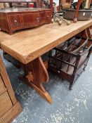 A RUSTIC PINE KITCHEN TABLE.