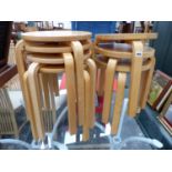 SEVEN BENTWOOD BEECH STOOLS.