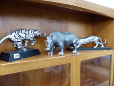 AN ALLOY MODEL OF A STALKING BIG CAT TOGETHER WITH A RHINO FIGURE AND A RUNNING TIGER FIGURE.