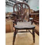 A WHEEL BACK CHILDS CHAIR AND A SMALL VINTAGE STOOL.