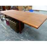 A LARGE MID-CENTURY DANISH TEAK EXTENDING DINING TABLE DESIGNED BY HENNING KJAERNULF