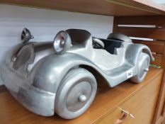 AN ALLOY LARGE MODEL OF A CAR.