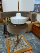 A RETRO SWIVEL CHAIR AND A RETRO HANGING LIGHT.