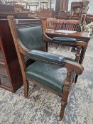 A LATE VICTORIAN MAHOGANY DESK CHAIR WITH GREEN LEATHER UPHOLSTERY.