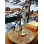 A BRASS DESK LAMP AND WOODEN LAZY SUSAN STAND.