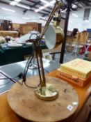 A BRASS DESK LAMP AND WOODEN LAZY SUSAN STAND.