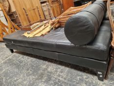 A PAIR OF BLACK LEATHER UPHOLSTERED DAY BEDS.