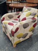 A MODERN FLORAL UPHOLSTERED ARMCHAIR