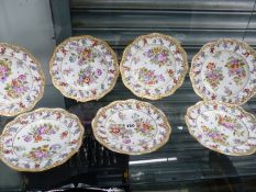 A SET OF SEVEN ANTIQUE HAND PAINTED FLORAL CABINET PLATES.