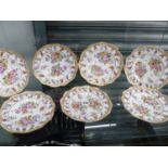 A SET OF SEVEN ANTIQUE HAND PAINTED FLORAL CABINET PLATES.