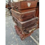 SEVEN VARIOUS VINTAGE SUITCASES.