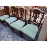 A SET OF FOUR LATE VICTORIAN DINING CHAIRS.