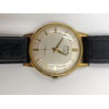 A VINTAGE ORIS ANTI SHOCK, 15 JEWEL WRIST WATCH ON A BLACK LEATHER STRAP.