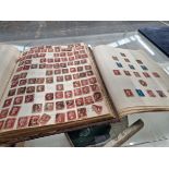 TWO STAMP ALBUMS CONTAINING A LARGE NUMBER OF GB PENNY REDS AND NUMEROUS OTHER GB AND WORLD STAMPS.