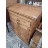 A PITCH PINE CLERKS DESK.