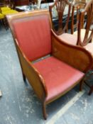 A MAHOGANY FRAME BERGERE ARMCHAIR.