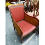 A MAHOGANY FRAME BERGERE ARMCHAIR.