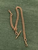 AN ANTIQUE 9ct STAMPED WATCH ALBERT CHAIN. THE T-BAR AND EACH LINK STAMPED 9ct AND ASSESSED AS 9ct