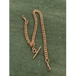 AN ANTIQUE 9ct STAMPED WATCH ALBERT CHAIN. THE T-BAR AND EACH LINK STAMPED 9ct AND ASSESSED AS 9ct