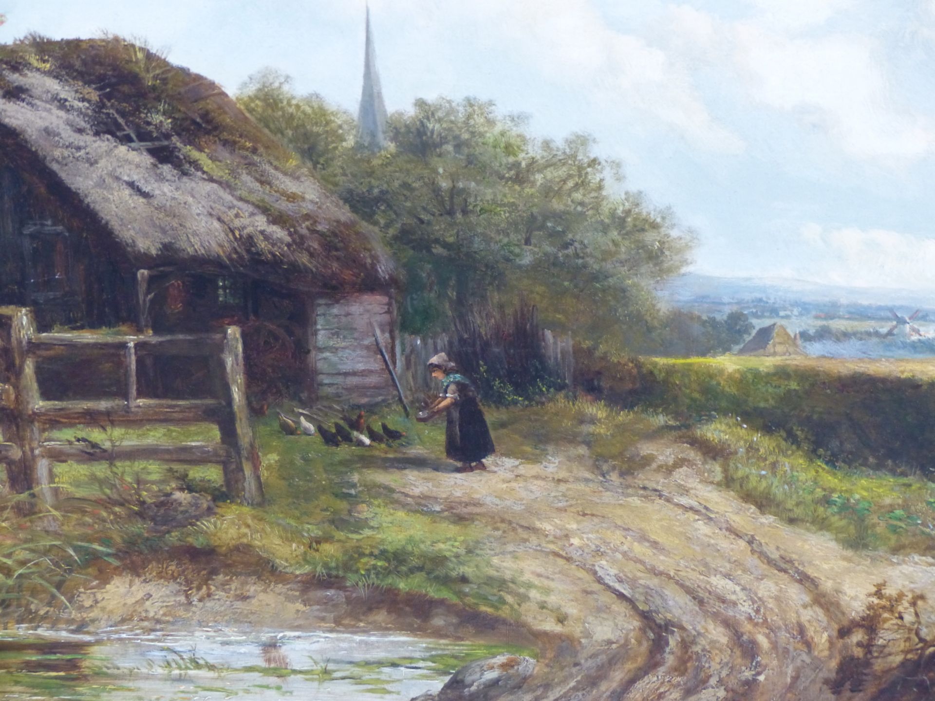 J THORS (ENGLISH SCHOOL) FEEDING CHICKENS BY A STREAM AND BARN,.WITH A WINDMILL IN THE DISTANT - Image 4 of 6