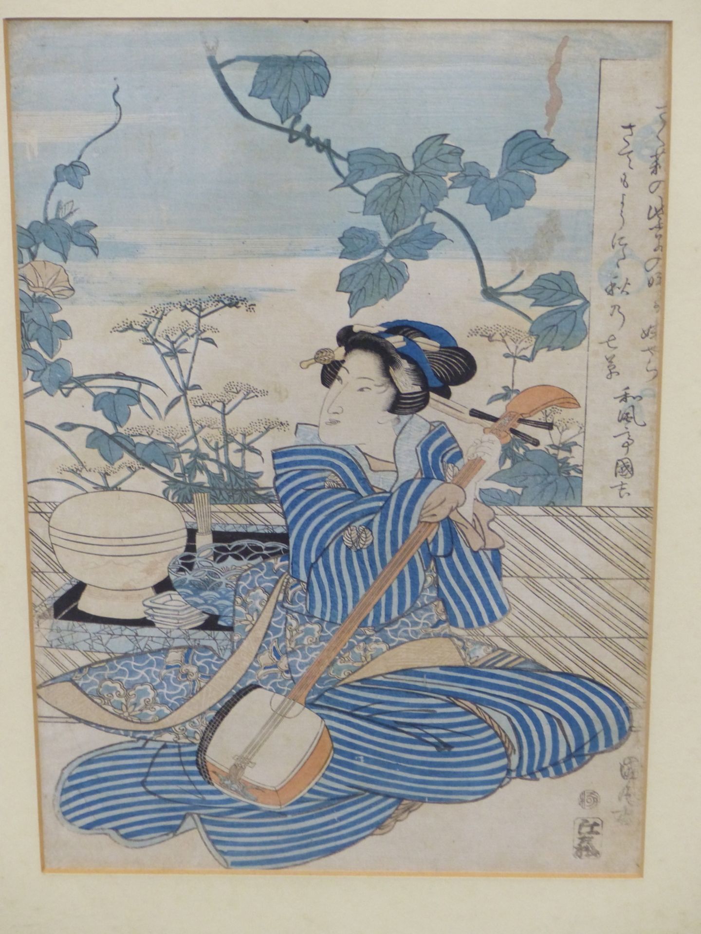 UTAGAWA KUNIMARU (EARLY 19TH CENTURY) GEISHA HOLDING A SAMISEN, COLOURED WOODBLOCK PRINT,