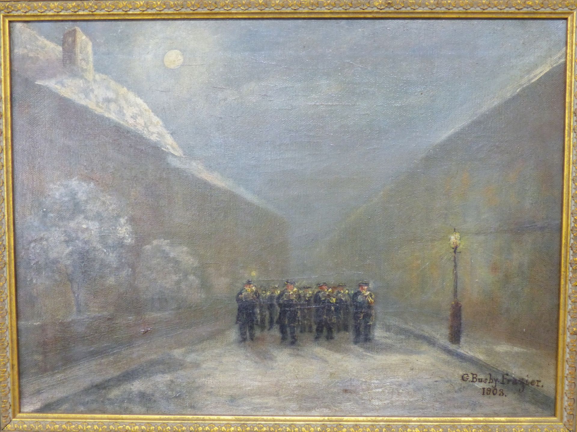 G. BUSBY FRAZIER (19th/20th.C. ENGLISH SCHOOL) MARCHING BAND ON A MOONLIT STREET OIL ON CANVAS.