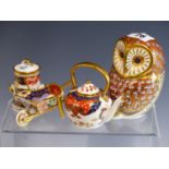 A ROYAL CROWN DERBY OWL PAPERWEIGHT TOGETHER WITH A MINIATURE WHEELBARROW, TEAPOT, AND MILK CHURN.