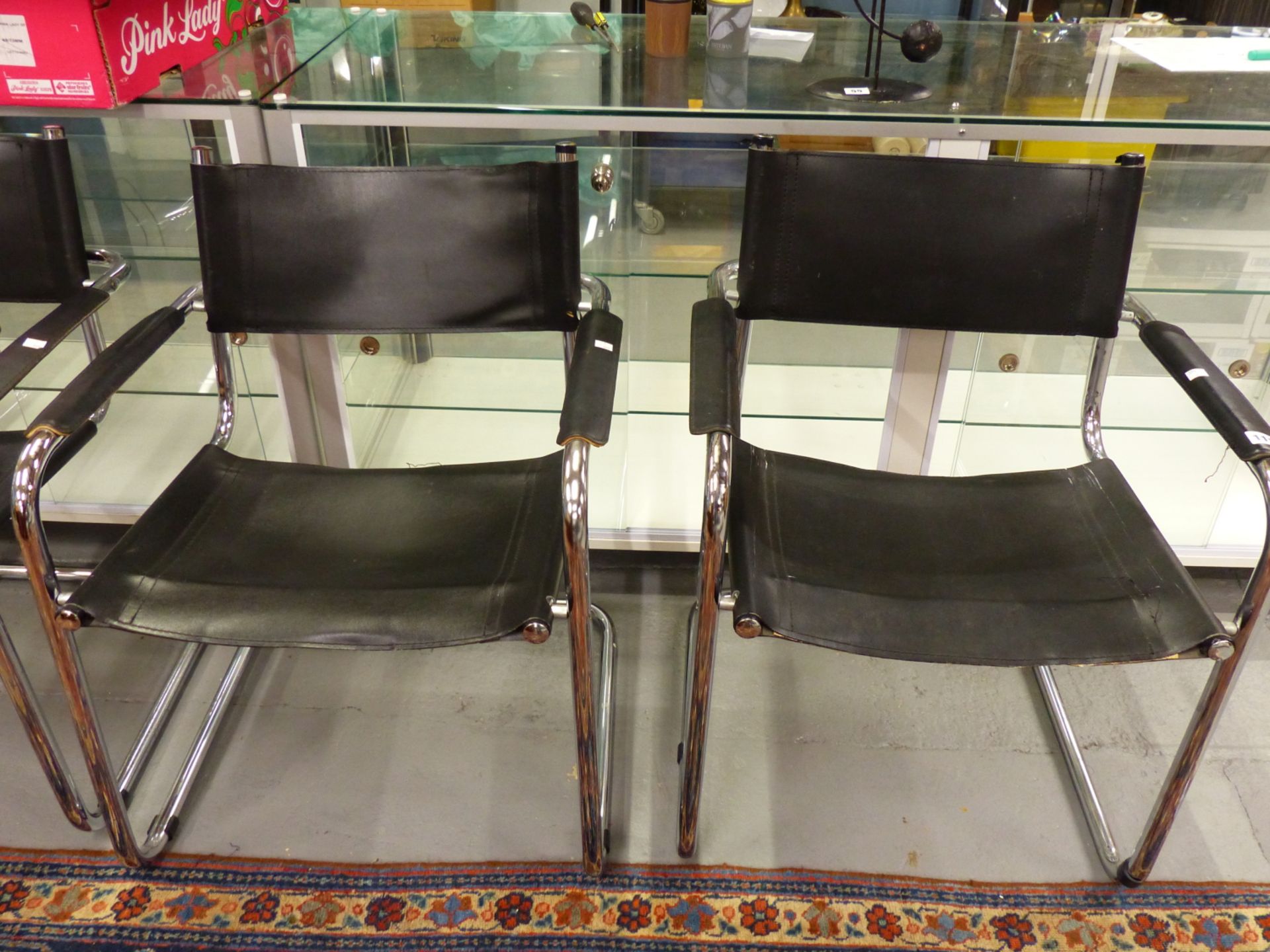 A SET OF FOUR CHROME AND LEATHER RETRO ARMCHAIRS AFTER A DESIGN BY MARCEL BREUER. - Image 3 of 4