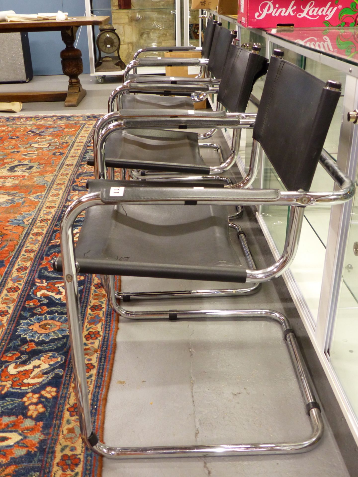 A SET OF FOUR CHROME AND LEATHER RETRO ARMCHAIRS AFTER A DESIGN BY MARCEL BREUER. - Image 2 of 4