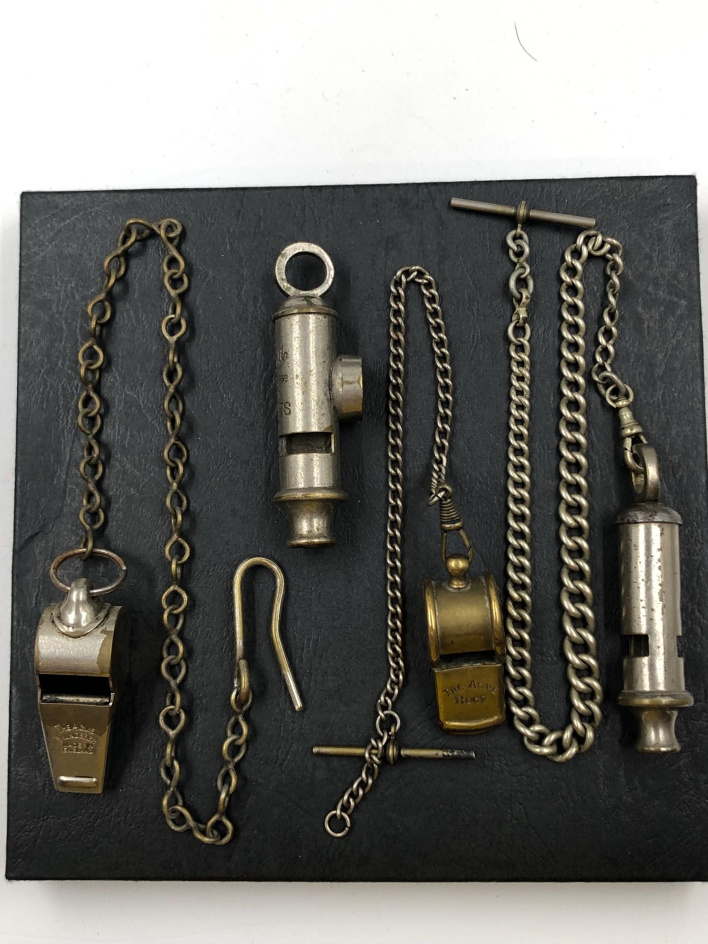 VINTAGE WHISTLES TO INCLUDE EMCA BOY SCOUTS, AN ACME REFEREE ON A GRADUATED ALBERT CHAIN, AN ACME