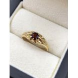 A 9ct HALLMARKED GOLD GARNET GYPSY SET RING. FINGER SIZE S. WEIGHT 2.28grms.