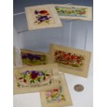 SIX WWI PERIOD SILK EMBROIDERED SWEETHEART POSTCARDS AND AN ARABIC COIN WITH A NOTE STATING "GIFT