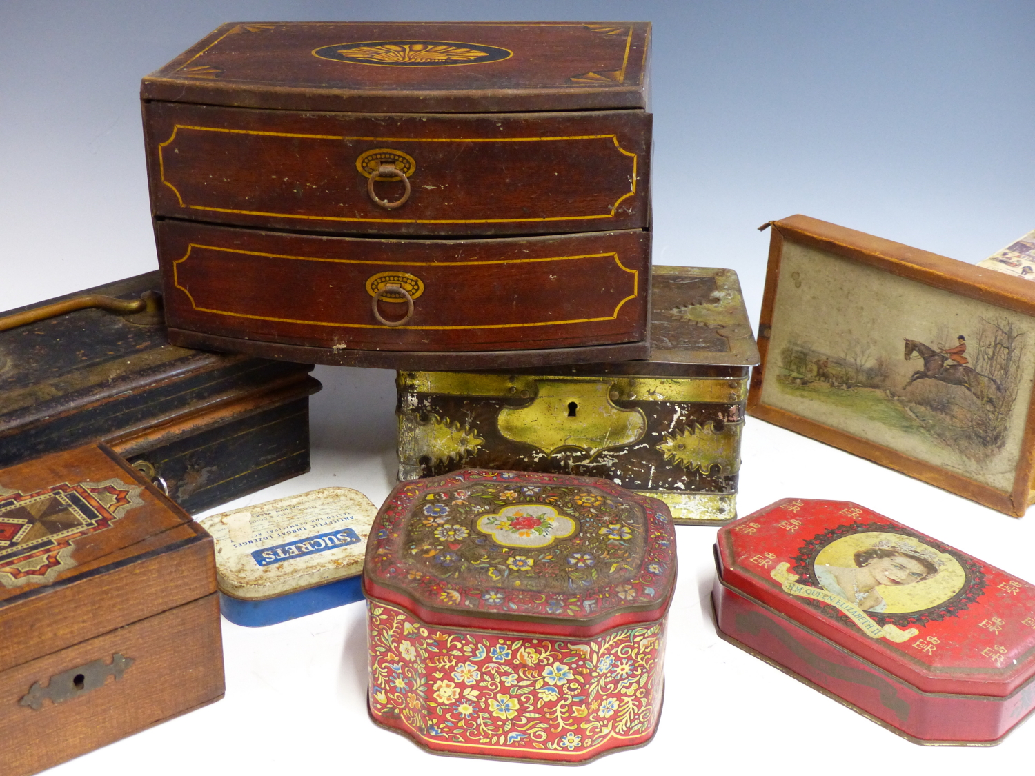 A GROUP OF VINTAGE COLLECTORS TINS TO INCLUDE JOHN BUCHANAN, GEORGE BASSETT, AND OTHERS.