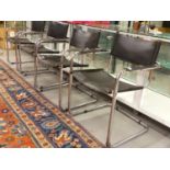 A SET OF FOUR CHROME AND LEATHER RETRO ARMCHAIRS AFTER A DESIGN BY MARCEL BREUER.