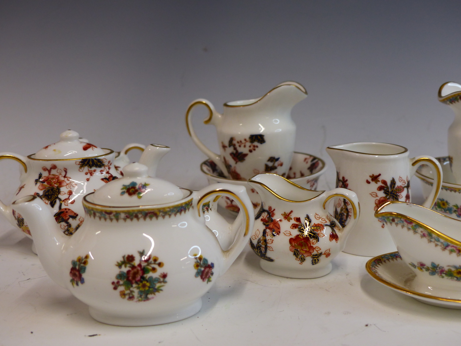 A COALPORT HONG KONG PATTERN MINIATURE TEA SERVICE AND A COALPORT MING ROSE MINIATURE TEA SERVICE. - Image 3 of 5