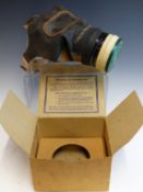 A WORLD WAR II PERIOD GAS MASK IN ORIGINAL CARD BOX, TOGETHER WITH A MILITARY TYPE HINGED LID BOX.