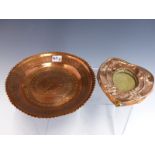 AN ARTS AND CRAFTS BEATEN COPPER SMALL PHOTO FRAME TOGETHER WITH A DECORATED COPPER SHALLOW BOWL.(