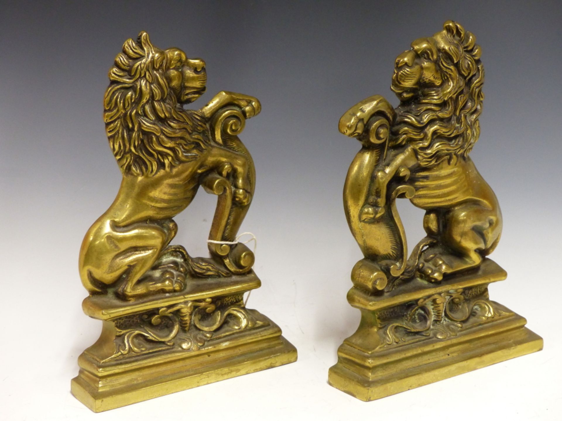 A PAIR OF ANTIQUE CAST BRASS RAMPANT LION FIRESIDE STANDS OR DOORSTOPS. - Image 2 of 2