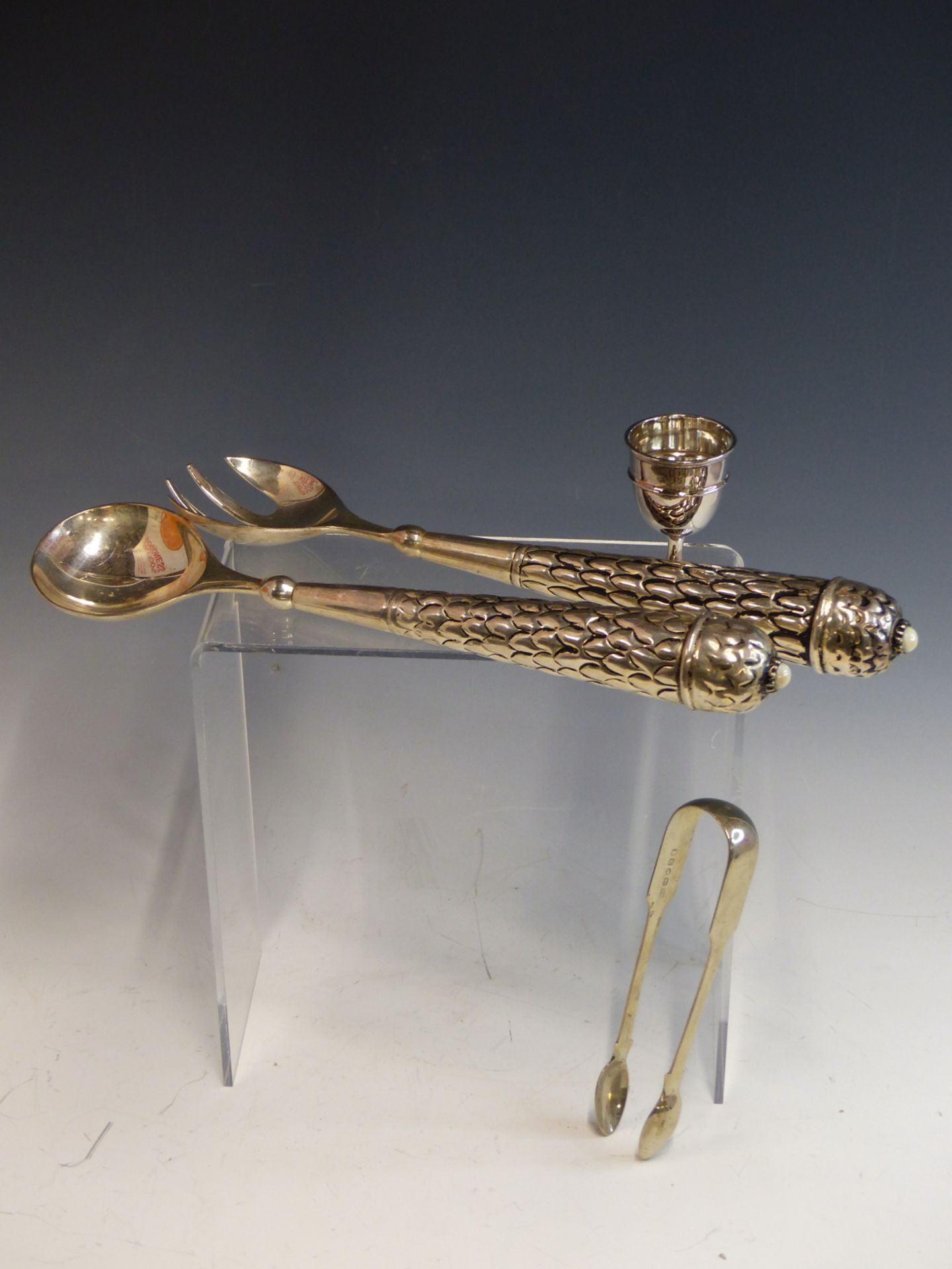 A PAIR OF EASTERN WHITE METAL SALAD SERVERS, EACH HANDLE INSET WITH LUSTRE CABUCHON. TOGETHER WITH A - Image 2 of 3