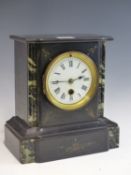A LATE VICTORIAN BLACK SLATE AND MARBLE INLAID MANTLE CLOCK.