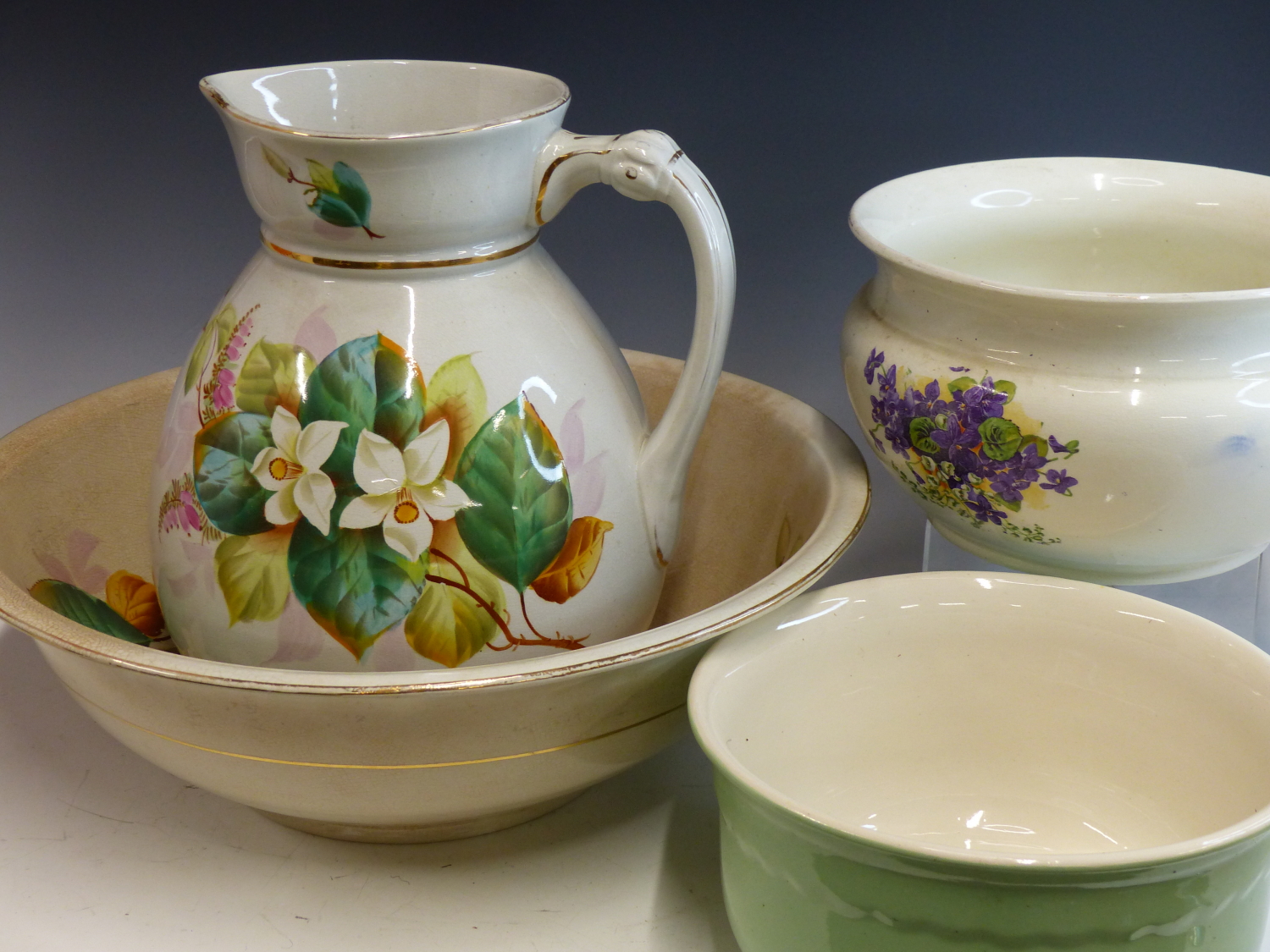 AN EARLY 20th CENTURY POTTERY WASH JUG AND BOWL SET WITH COTTAGE AND FLORAL DECORATION, AND TWO - Image 2 of 2